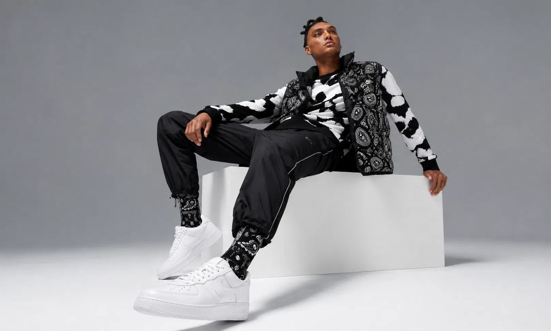A streetwear look styled with classic white Nike Air Force 1 Low sneakers